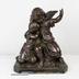 Estatua de niño y ángel en cobre fundido